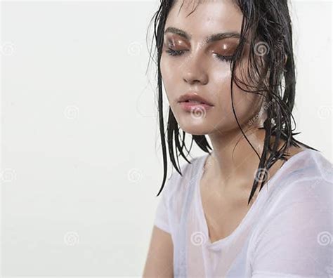 Beautiful Wet Brunette Girl With Water Drops Running Down Her Fa Stock