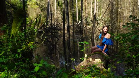 sexy girl leaning huge tree in rainforest background waterfall stock footage video 3045112