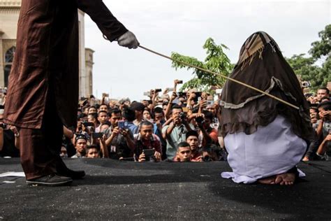 indonesian woman caned after adultery conviction in aceh sharia court abc news australian
