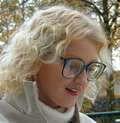 laet cute blonde girl wearing big glasses a photo on