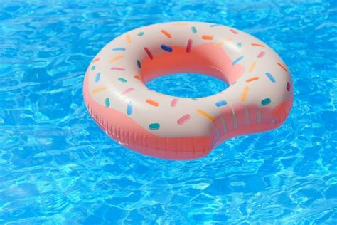Premium Photo Inflatable Donut Floating In Swimming Pool