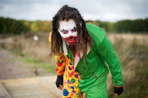 video shows runners get chased by clown holding a knife