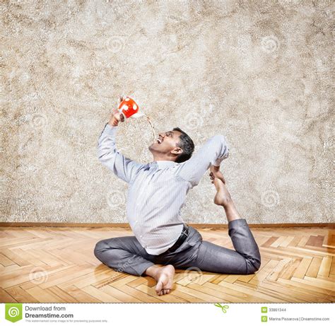 businessman drinking tea  yoga pose stock photo image  joyful