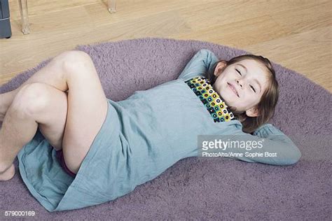 girl lying on floor with hands behind head bildbanksfoton och bilder
