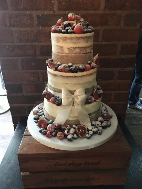 semi naked wedding cake with berries and fruit mel s