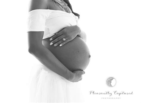 beautiful mommy to be cradles her growing belly maternity