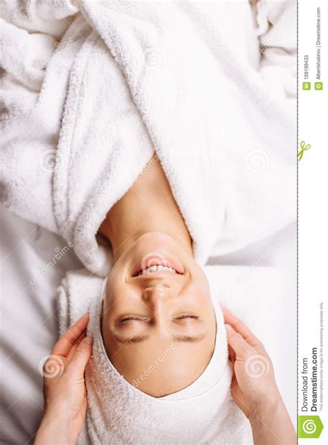 girl having spa facial massage in luxurious beauty salon stock image
