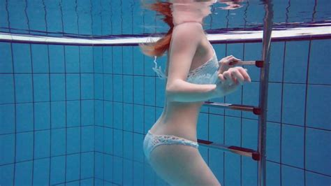 incredible underwater striptease show performed by redhead