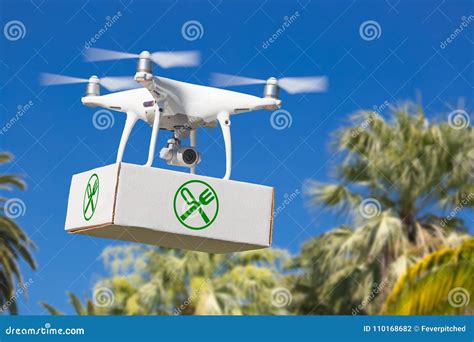 unmanned aircraft system uav quadcopter drone carrying package stock photo image  trees