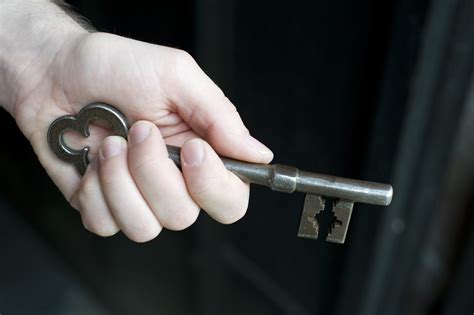 hand holding  metallic vintage key  stockarch  stock photo