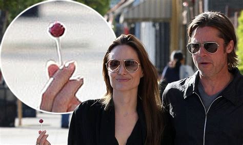 angelina jolie sucks on a lollipop as she goes on a romantic shopping date with brad pitt