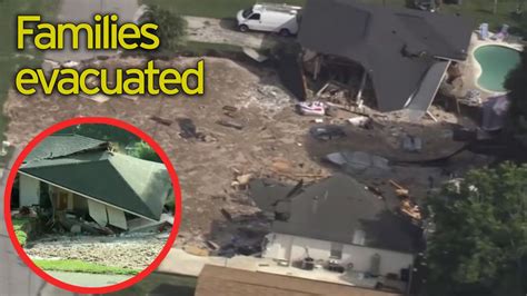 giant 50ft deep sinkhole swallows two houses a boat and a