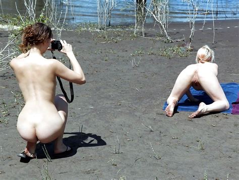 Girl Taking A Picture Of Another On All Fours Porn Pic