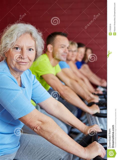 Senior Woman In Spinning Class Royalty Free Stock Image
