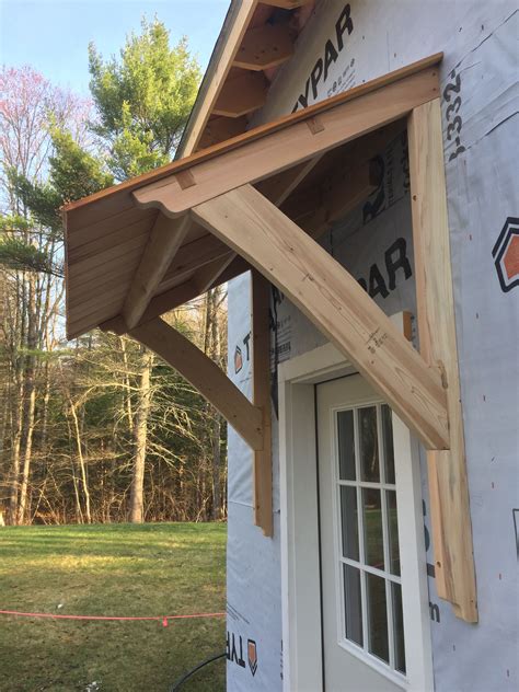 awning barn mortiseandtenon cedar house awnings house exterior porch roof