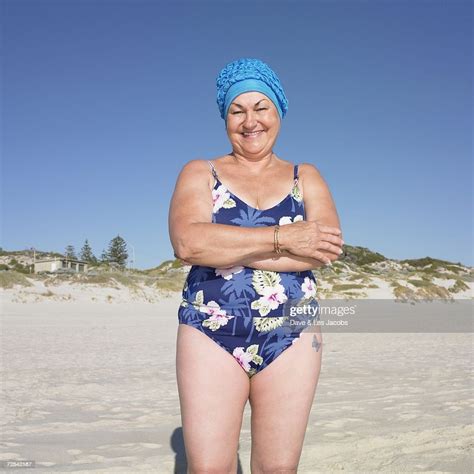 Senior Woman In Bathing Suit Smiling At Beach Photo Getty Images
