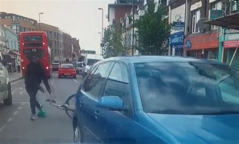 cyclist armed with huge knife smashes driver s window in