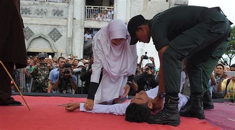 indonesian man faints during caning revived and caned again photos — rt news