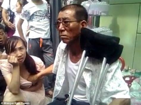 chinese man shown telling a woman s fortune by touching her breast
