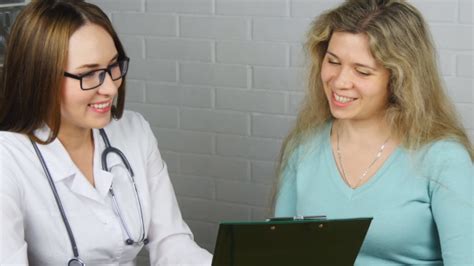doctor explaining diagnosis to her female patient by chizheffsky