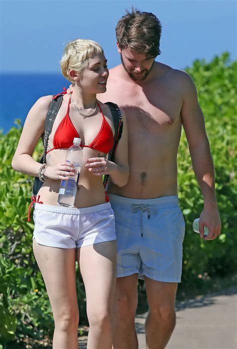 Miley Cyrus Wearing Tiny Red Bikini And Seethrough Shorts At A Vacation