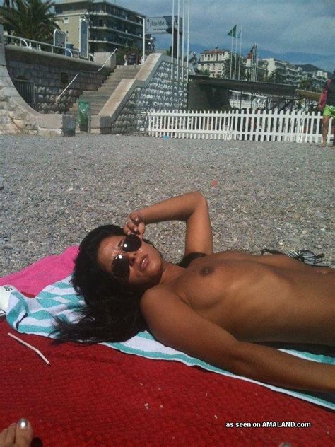kinky latina chick sunbathing topless