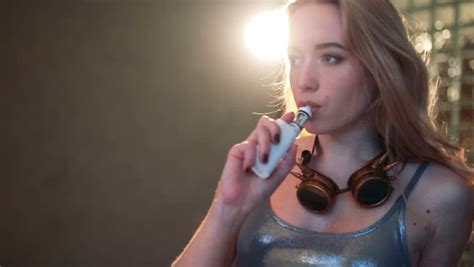 sexy girl with glasses smokes vape stock footage video 24072532 shutterstock