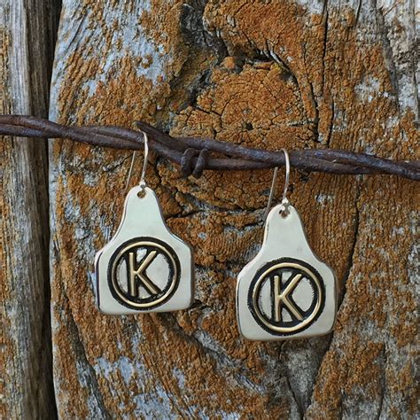 Cattle ear tag earrings with custom brand by ArteVae