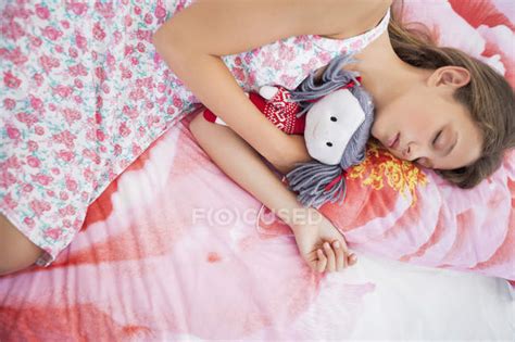Innocent Teenage Girl Sleeping On Bed With Rag Doll — Female