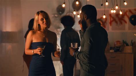Drunk Blond Woman With Cocktail Talking And Flirting With Black Man