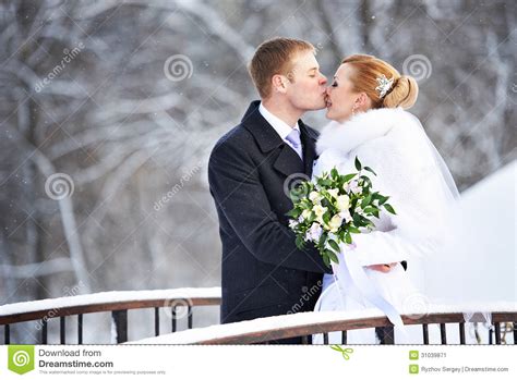 Romantic Kiss Happy Bride And Groom On Winter Day Stock