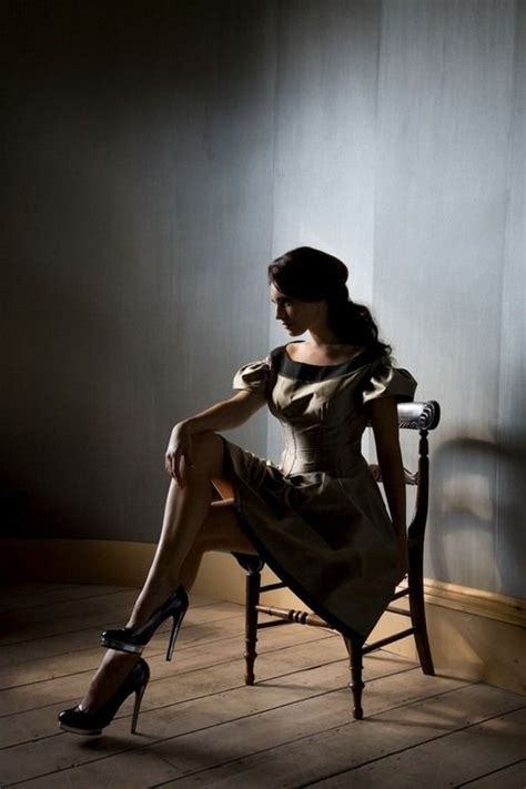dramatic lighting woman chair pose poses with