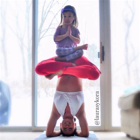 mother and 4 year old daughter do impressive yoga poses