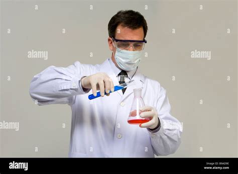 scientist mixing liquids stock photo alamy