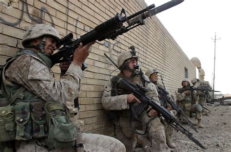 marines with fixed bayonets move through fallujah iraq