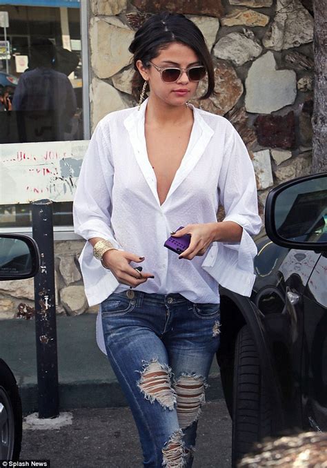 Selena Gomez Wears Super Low Cut Oversized Blouse And