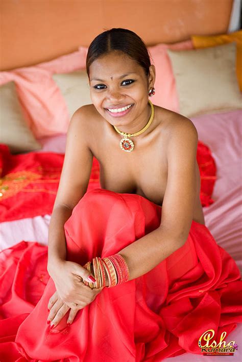 sweet indian girl asha kumara is sexy in a traditional red dress and jewelry