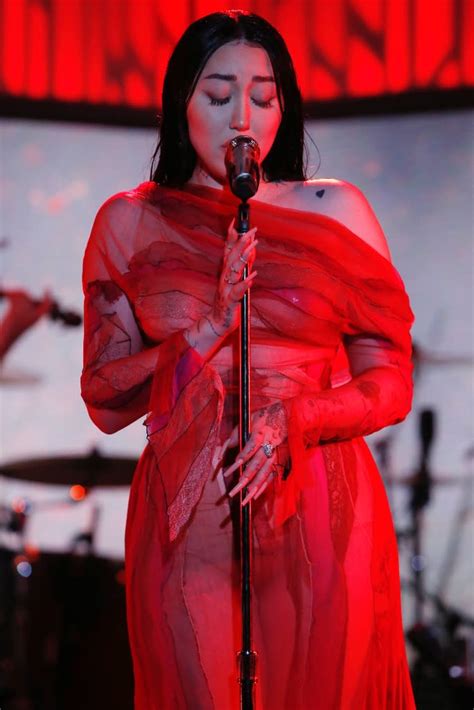 noah cyrus commands attention in risky red sheer dress and hidden heels