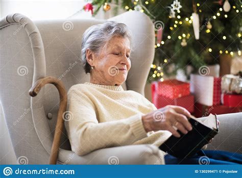 lonely senior woman smiling in camera royalty free stock