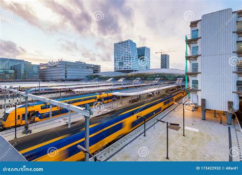 departing train  central station  utrecht netherlands  sunset editorial photography