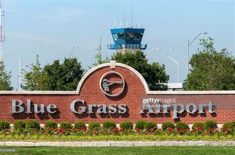 blue grass airport entrance sign grass blue