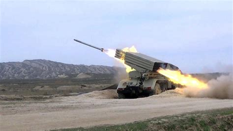 azerbaijani armys rocket  artillery units conduct  fire training photovideo