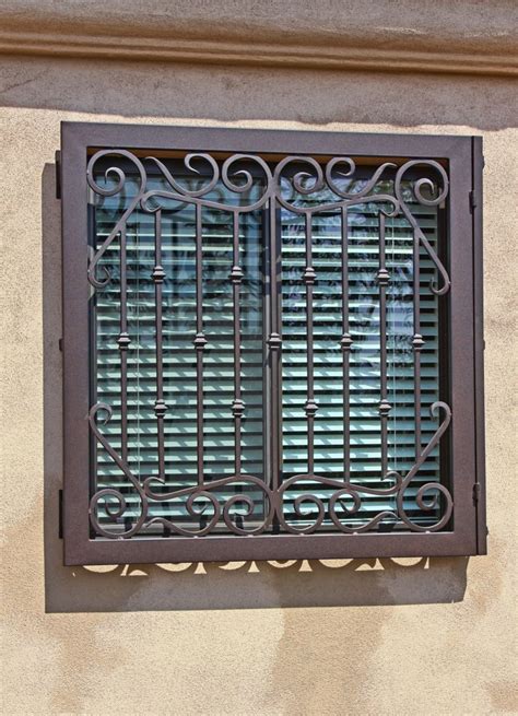 hinged iron window guard  impression ironworks