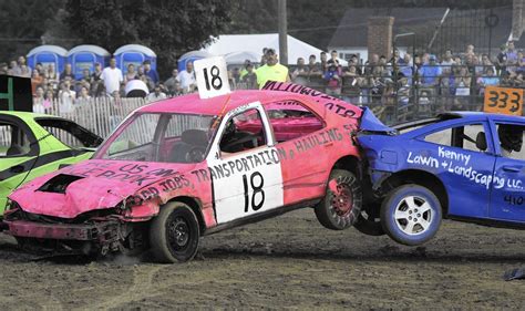 car crashes  smashes elicit cheers    fairs demolition derby