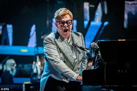 elton john 72 looks typically dazzling in a powder blue