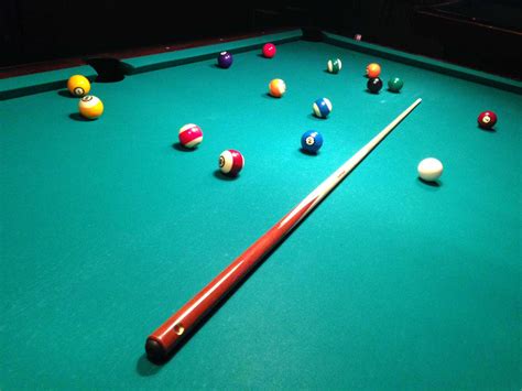 download a pool table with balls and cues on it