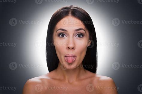 Funny Grimace Portrait Of Beautiful Young Shirtless Woman Looking At
