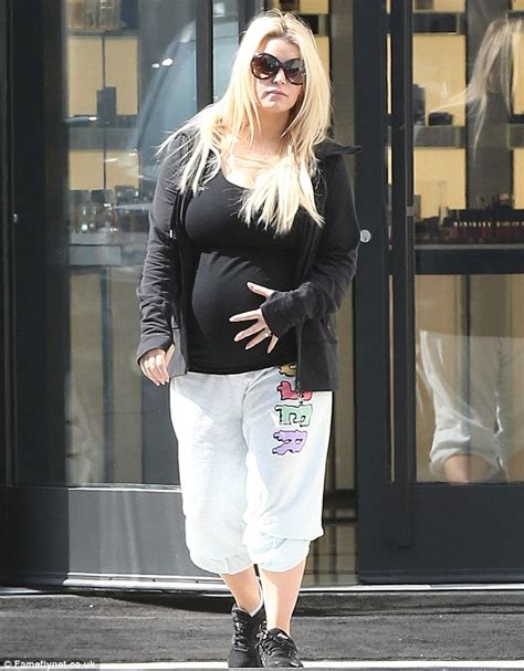 Pregnant Jessica Simpson Tenderly Cradles Her Huge Bump As She Hits The