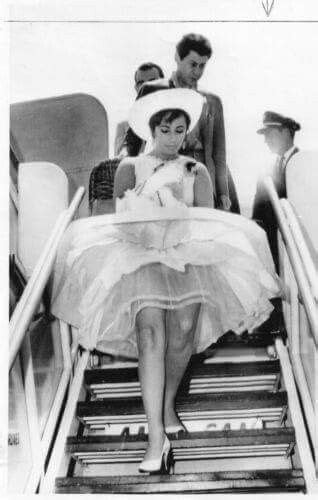 Liz Departing The Aircraft Just As A Gust Of Wind Blows Your Dress Up