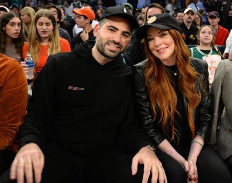 lindsay lohan  husband bader shammas smile   sit courtside   york knicks game